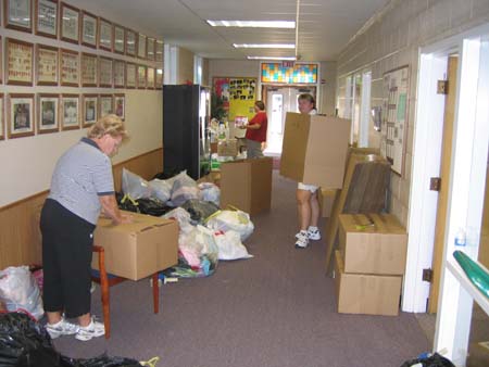 Zion Volunteers Chris Fischer Jeaneen Schlie Doona Coons repack over 100 boxes